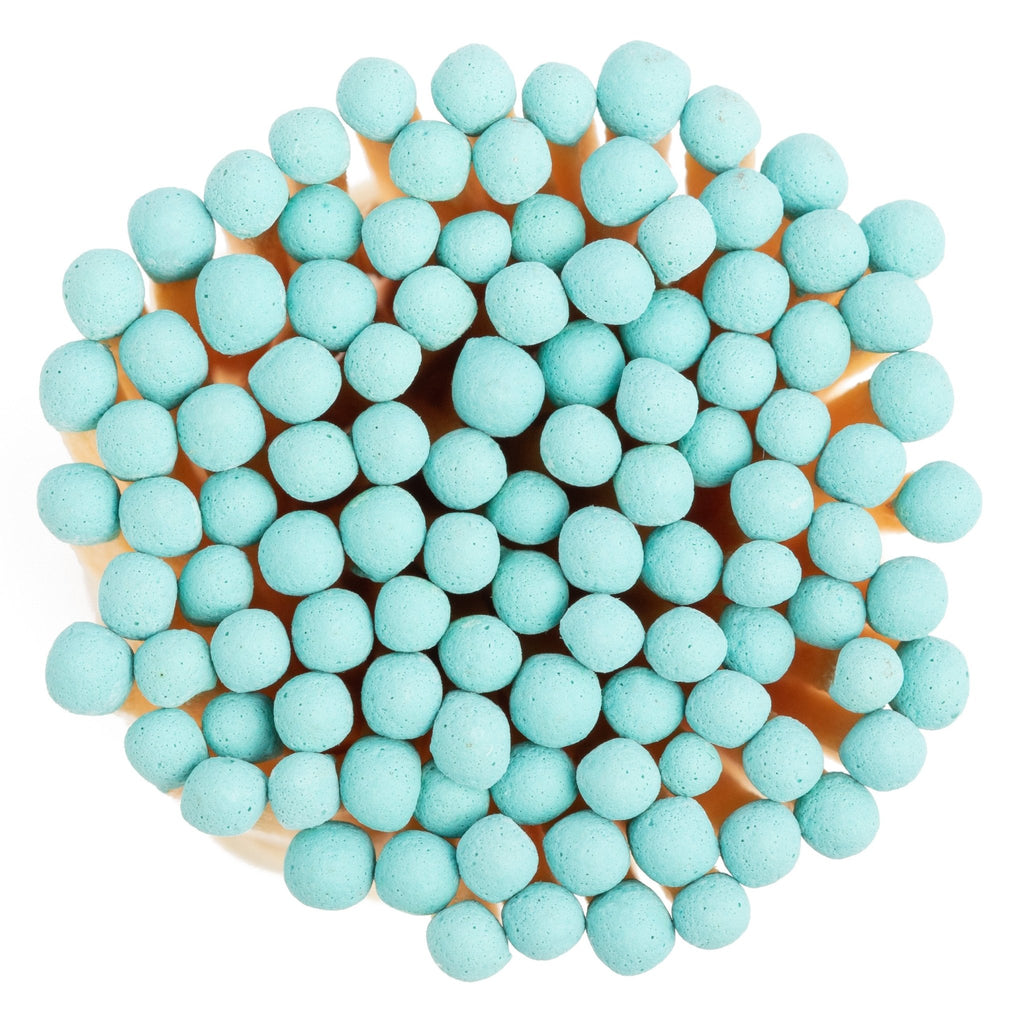 baby blue color tip wood matchsticks in corked vial with match striker