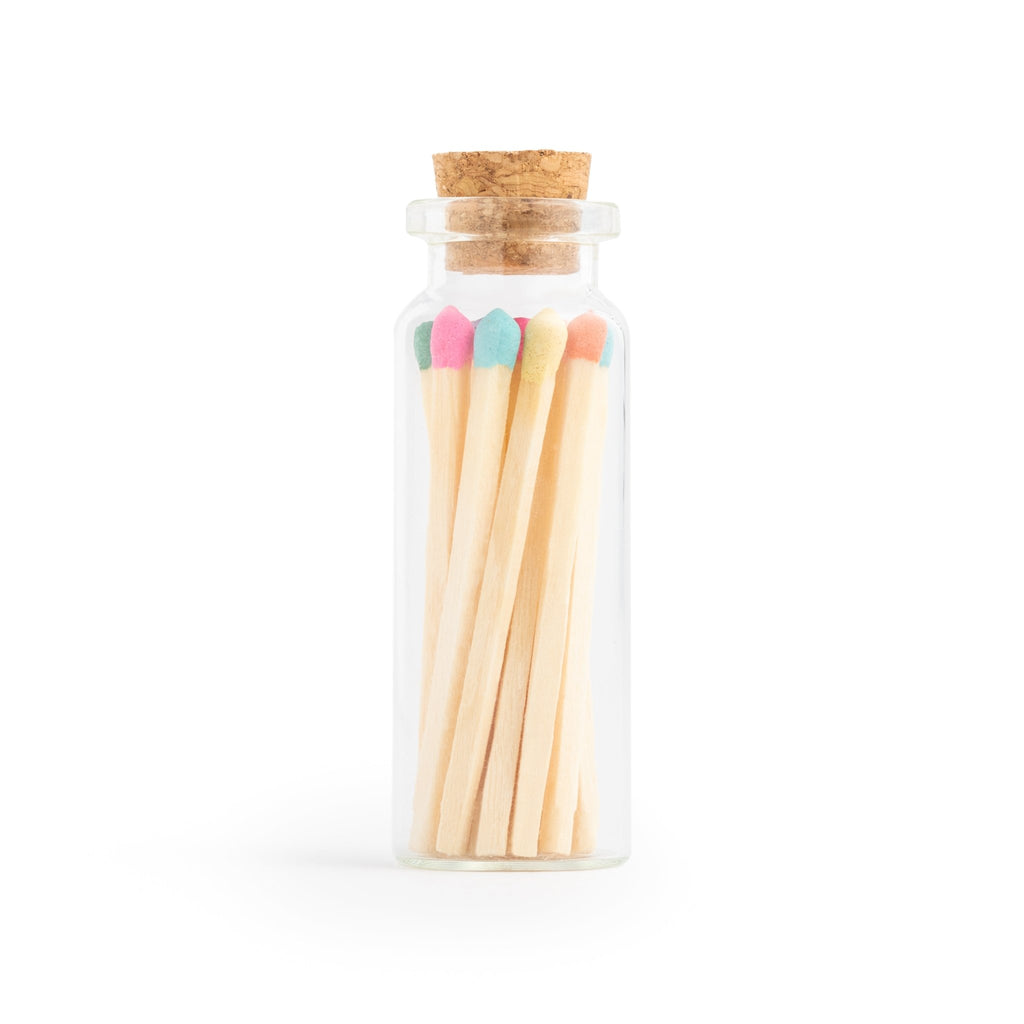 colorful wood matchsticks in corked vial