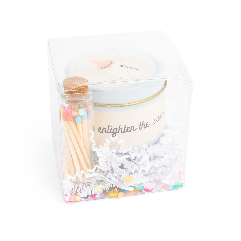 oatmeal milk and honey scented candle with a set of colorful wood matches