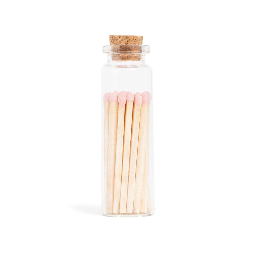 baby pink wood matches in corked vial with match striker