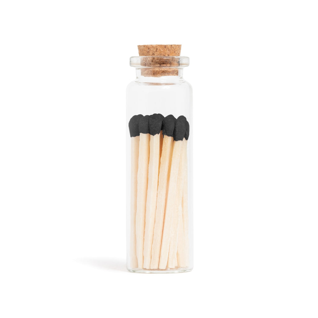 black color tip wood matches in corked jar with match striker