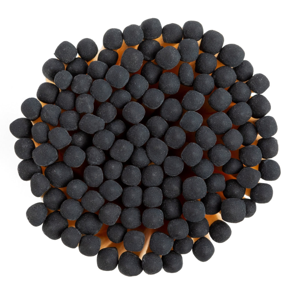 black color tip wood matches in corked jar with match striker