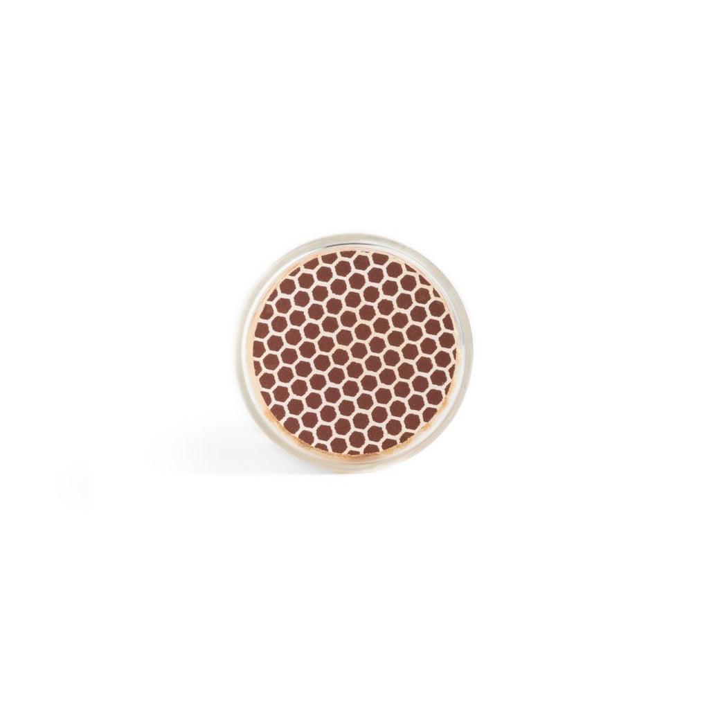 brown matchsticks in corked jar with match striker