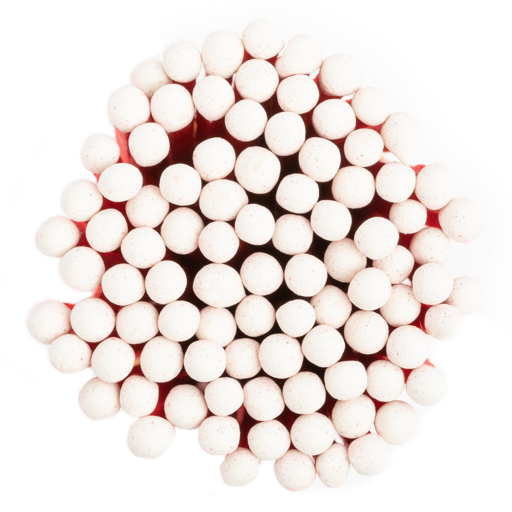 white and dark wood color tip wood matchsticks in corked match jar with match striker
