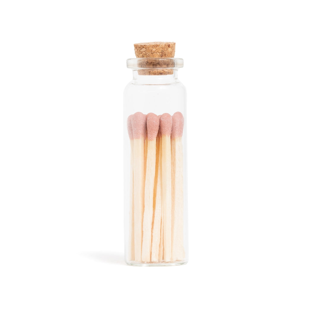 dusty rose color tip wood matchsticks in corked jar with match striker