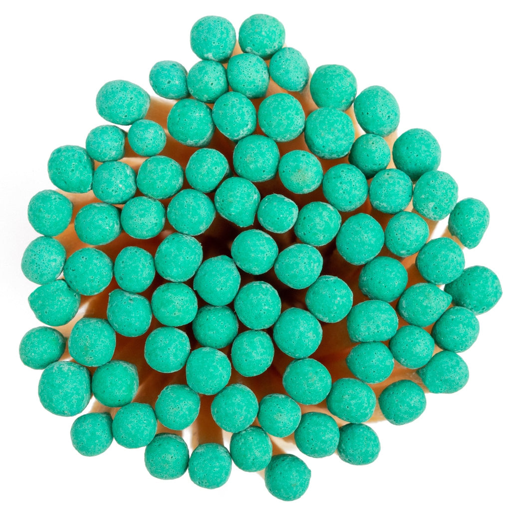 emerald green color tip wood matchsticks in corked jar with match striker