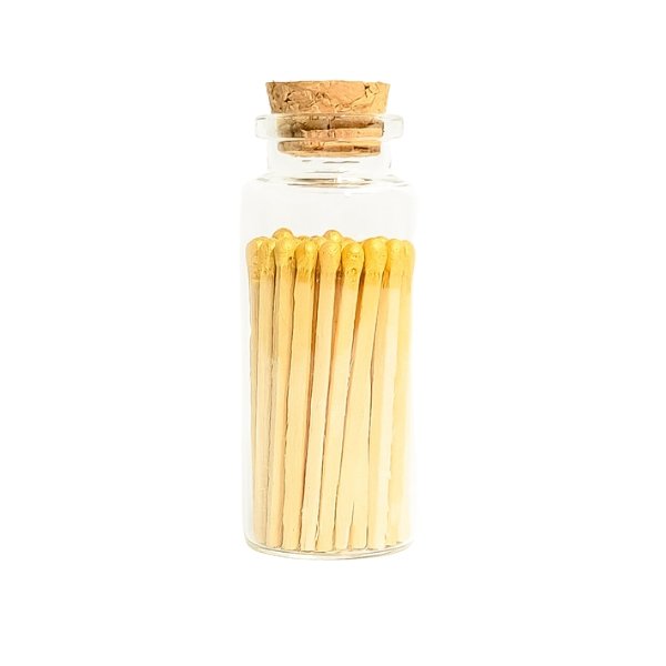 gold color tip wood matchsticks in corked jar with match striker