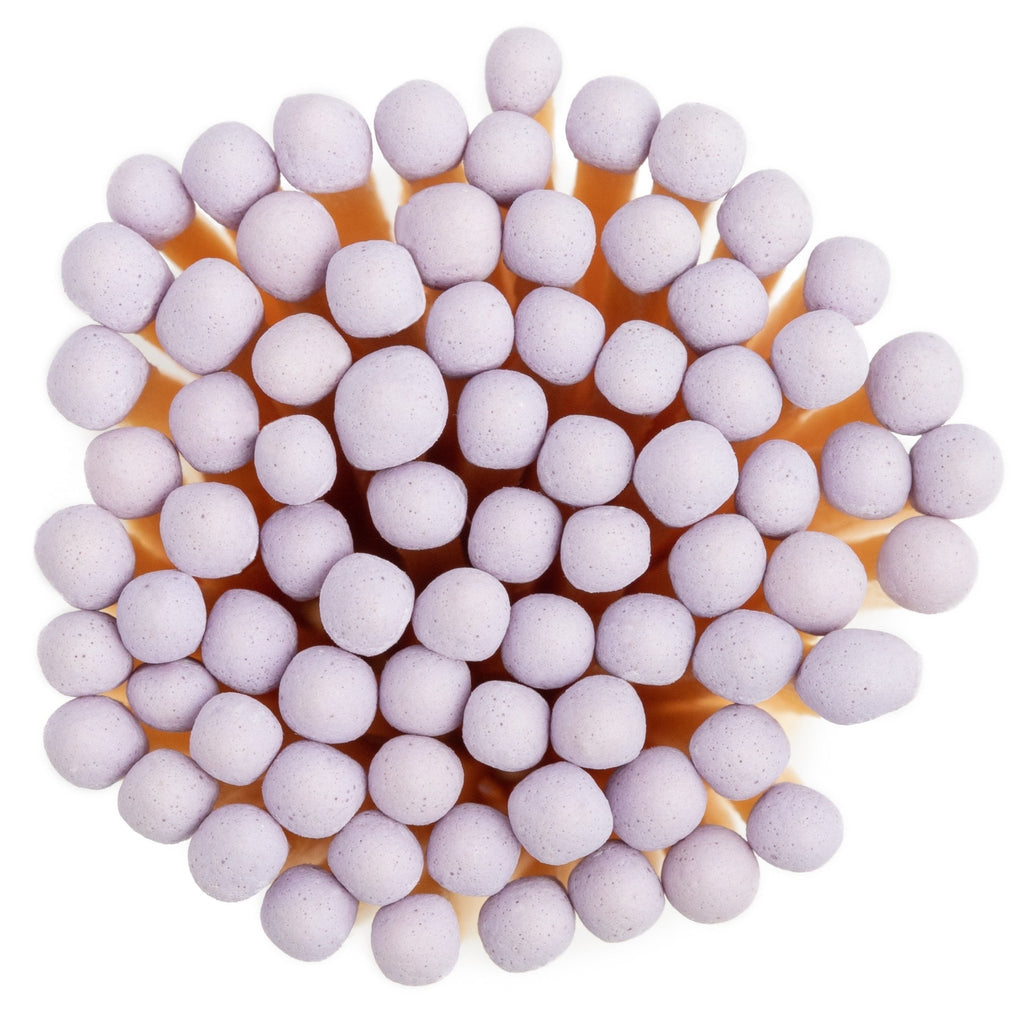 lavender color tip wood matchsticks in corked jar with match striker