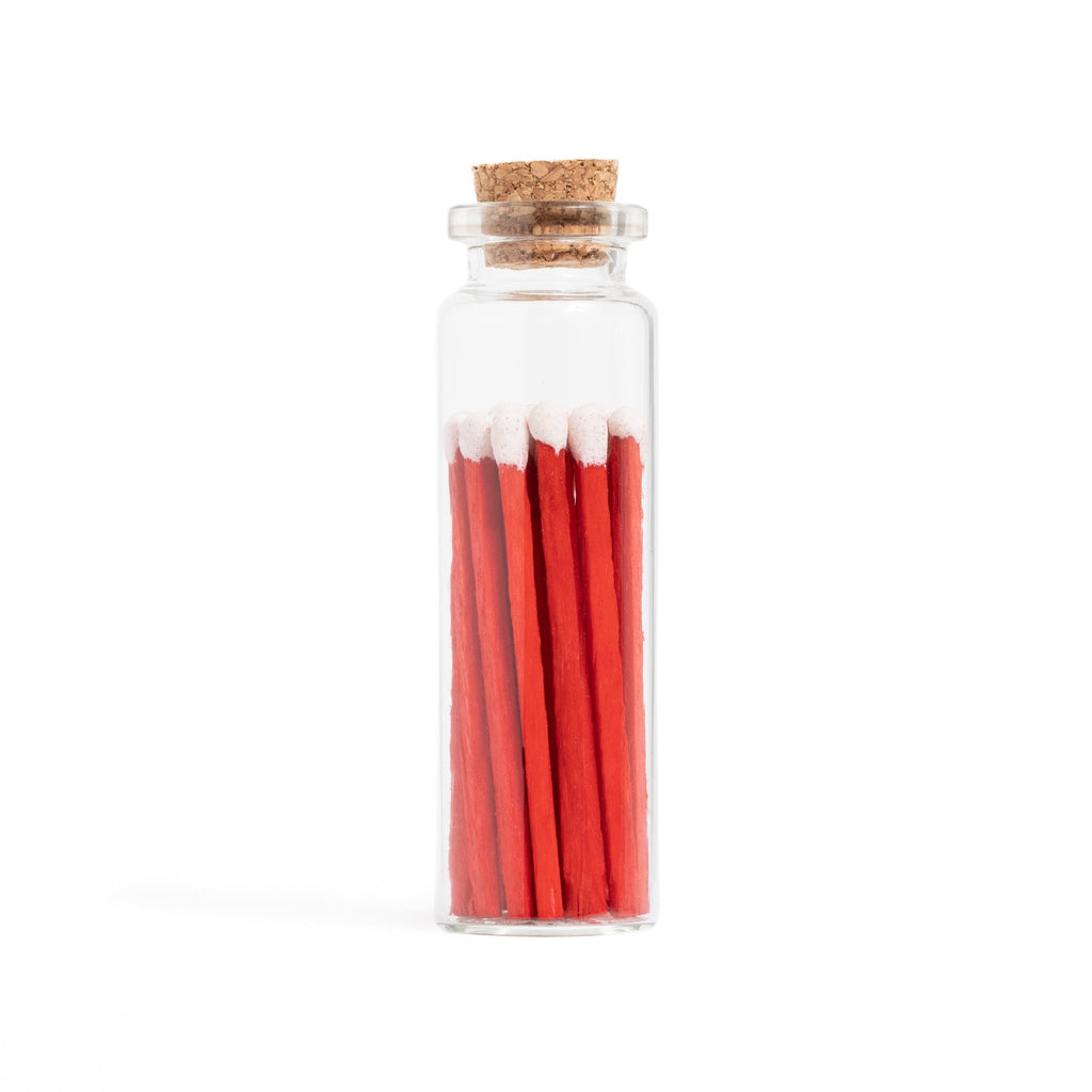 red velvet cake color tip wood matches in corked jar with match striker