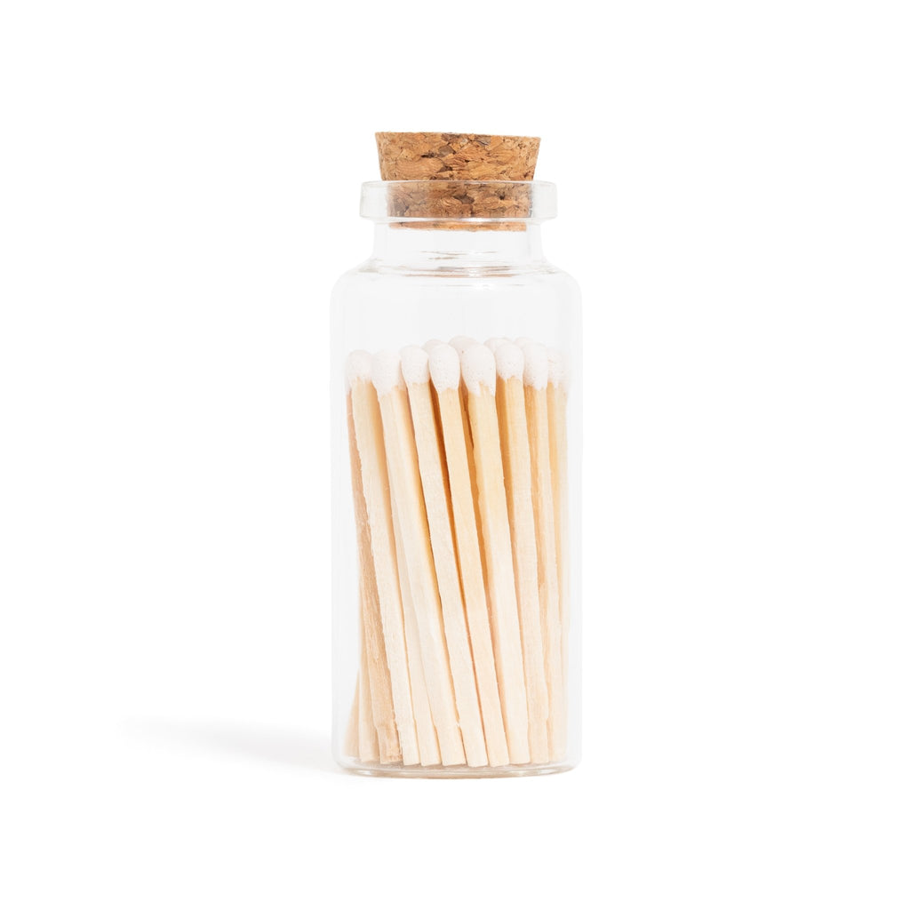 white color tip wood matches in corked jar with match striker