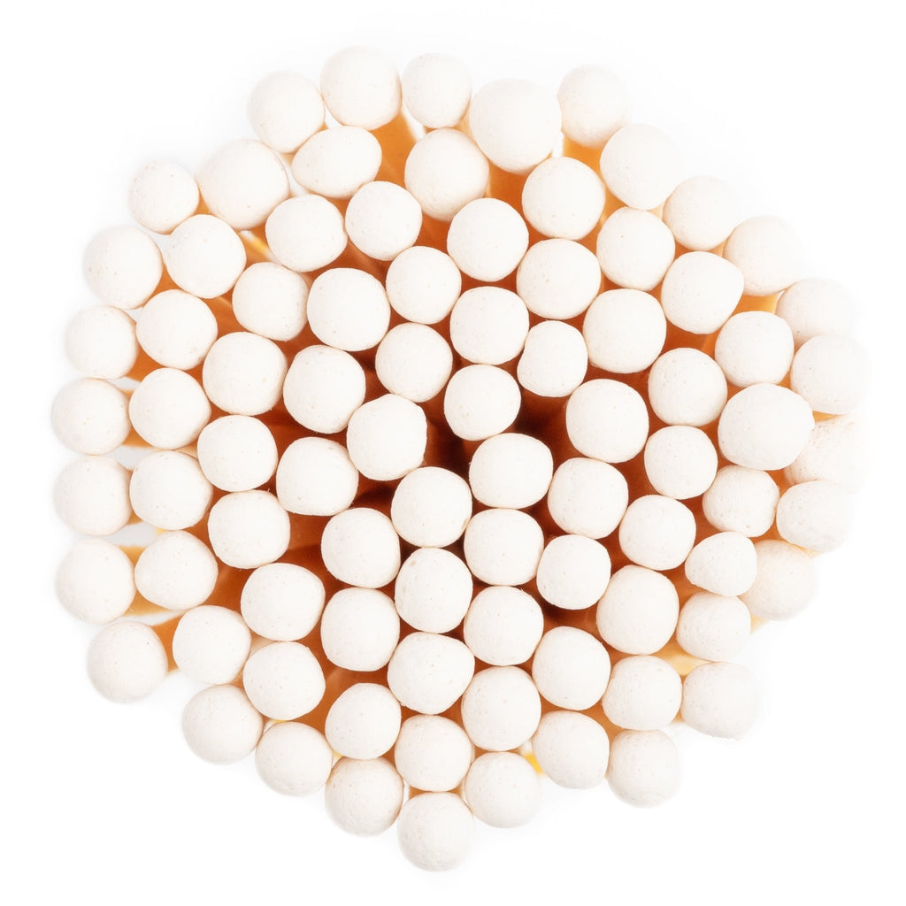 white color tip wood matches in corked jar with match striker