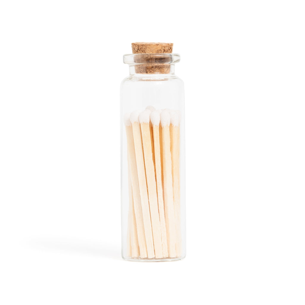 white color tip wood matches in corked jar with match striker